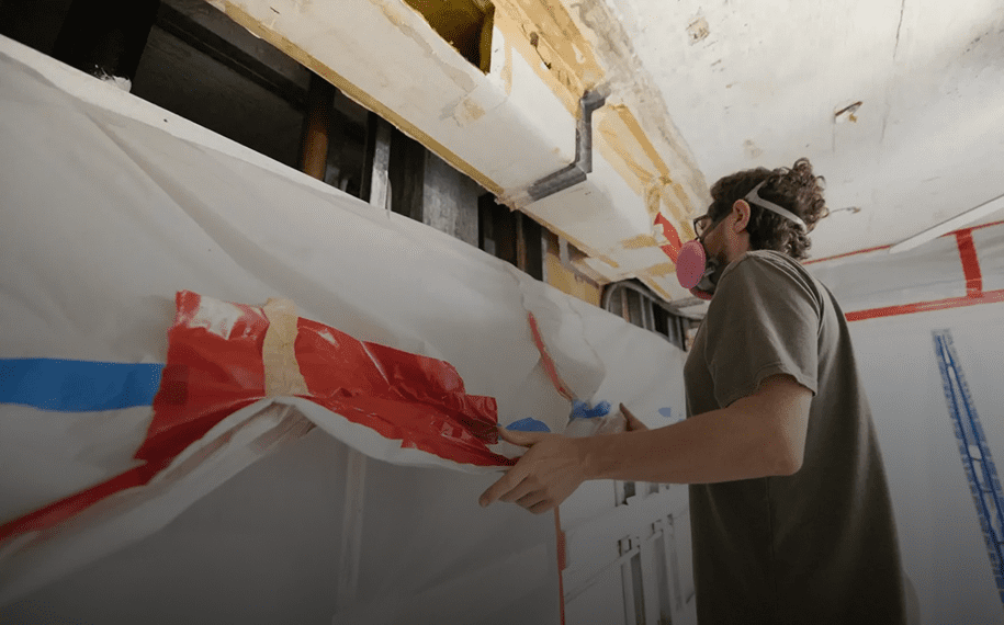 Man taking down safety covering