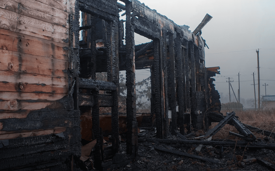 Burned wooden structure remains